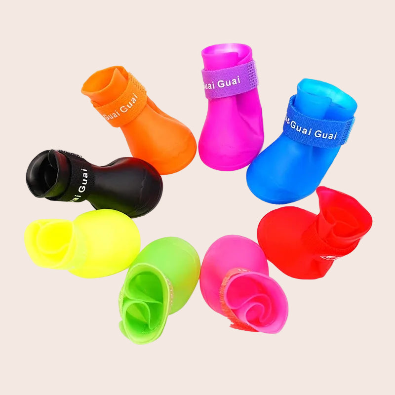 Colorful pet booties with 'Guai Guai' branding on a white background